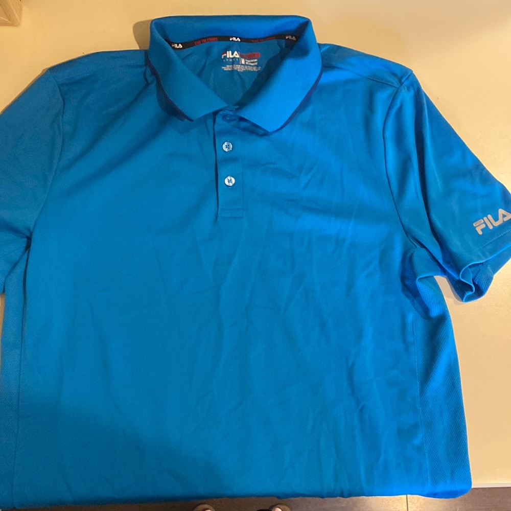 Blue size medium Fila golf polo. New condition!